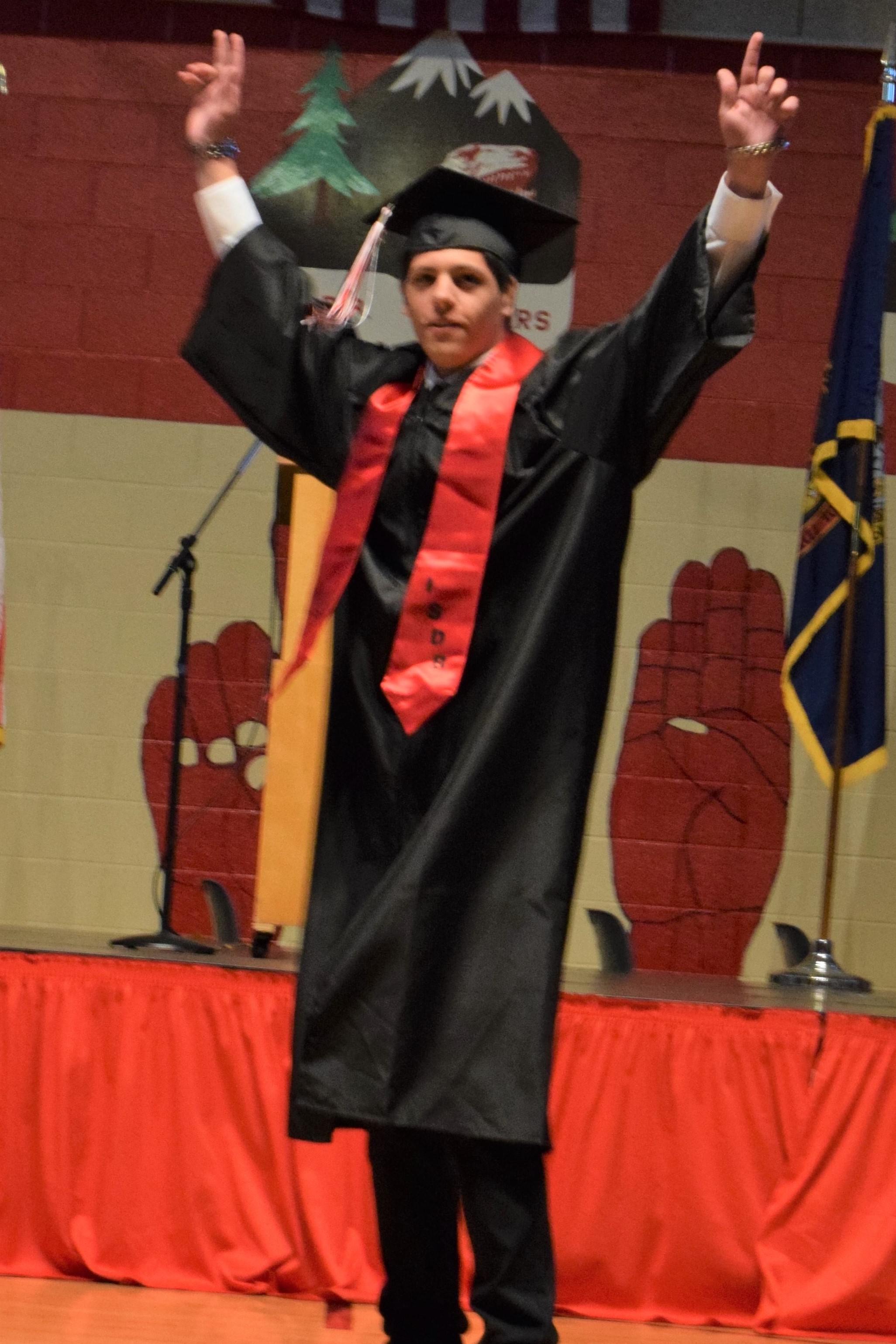 graduate celebrates after diploma