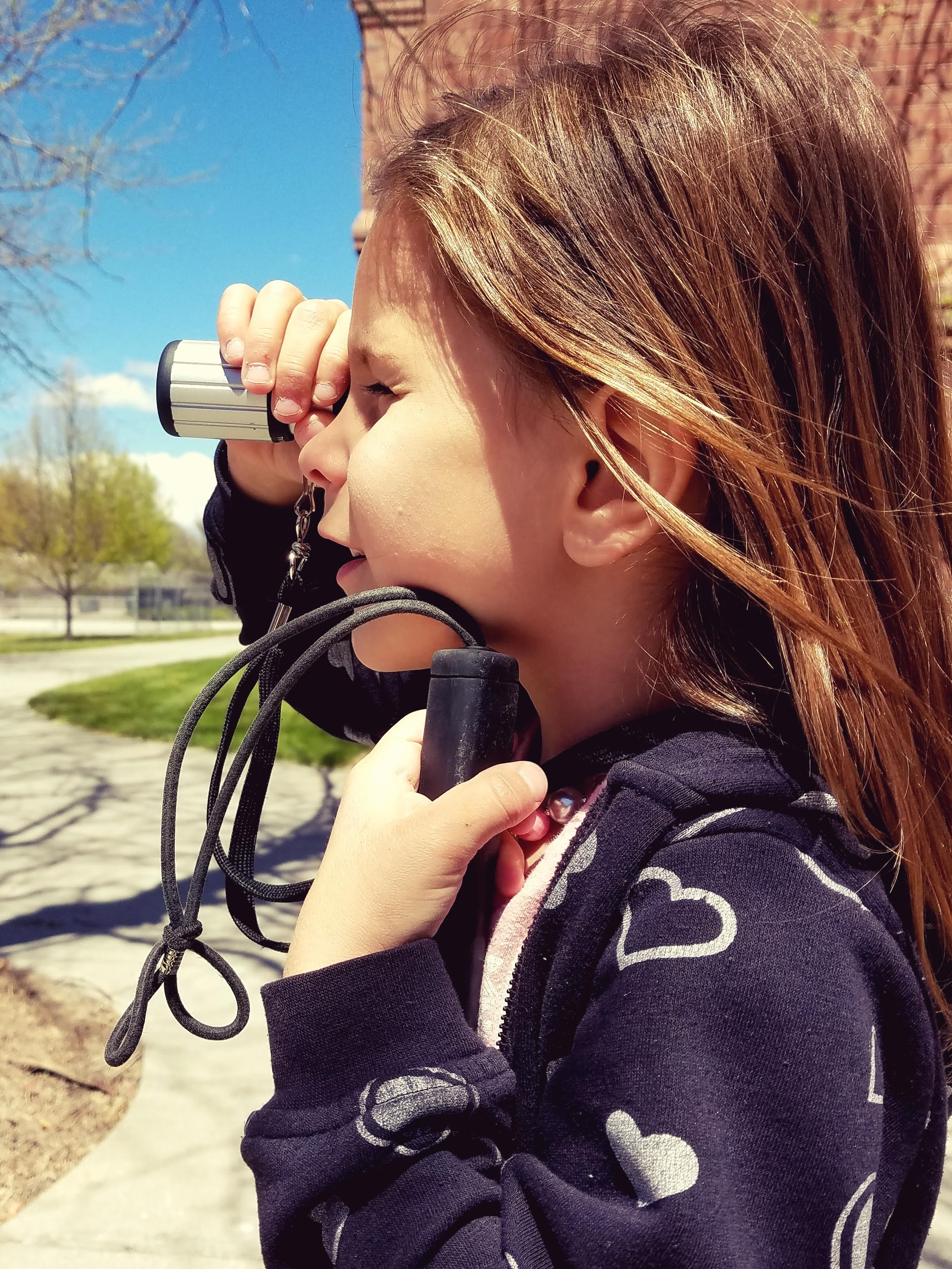 student using monocular device